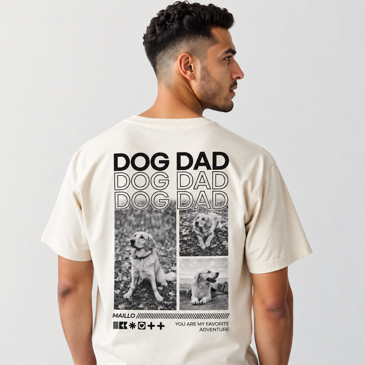 T-shirt beige con grafica "DOG DAD" e foto nere di cani sul retro.