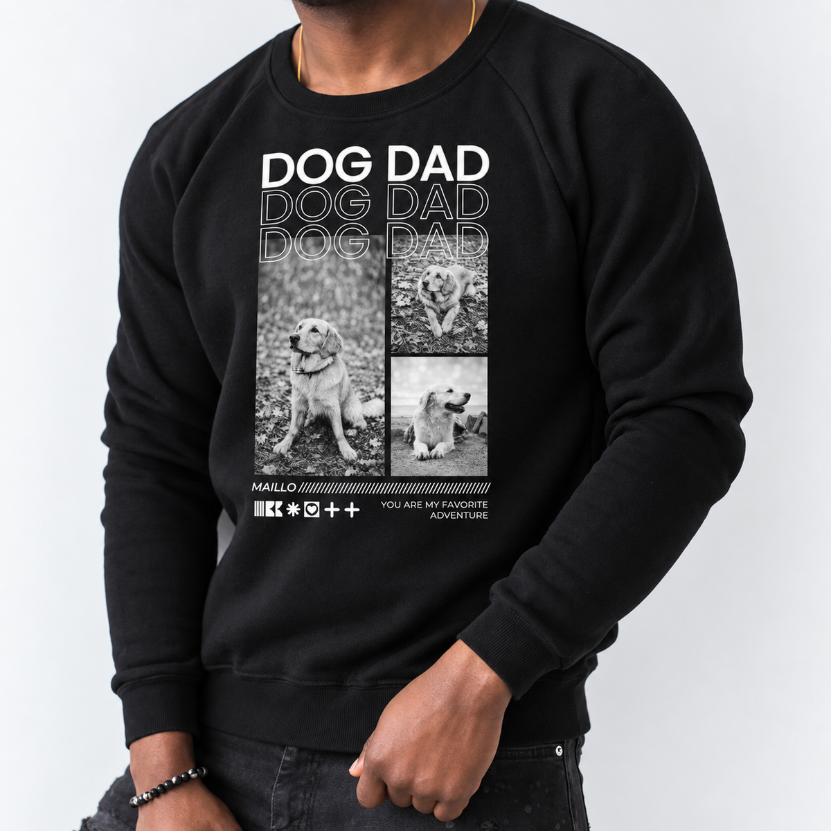 Felpa nera con la scritta "DOG DAD" e illustrazioni di cani sul davanti.