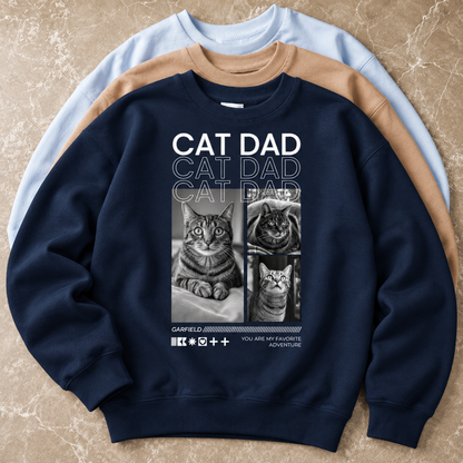 Felpa blu scuro con motivi di gatti e la scritta "Cat Dad" sul davanti.