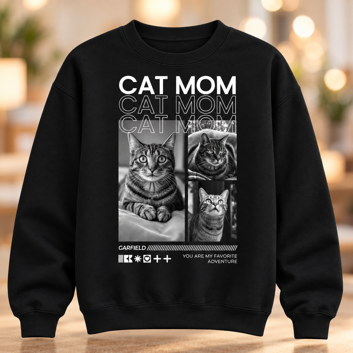 Felpa nera con la scritta "Cat Mom" e foto di gatti in bianco e nero.