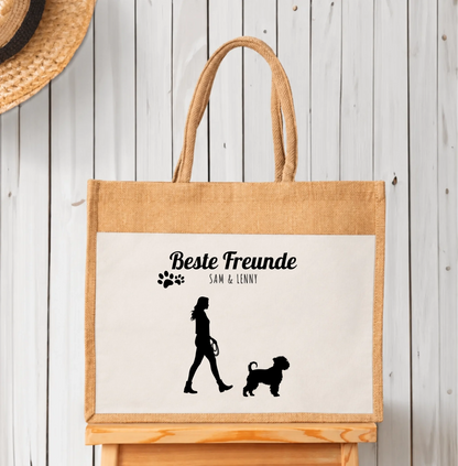 Borsa shopping personalizzata in iuta con sagome nere di persona e cane. Scritta “Migliori amici”.