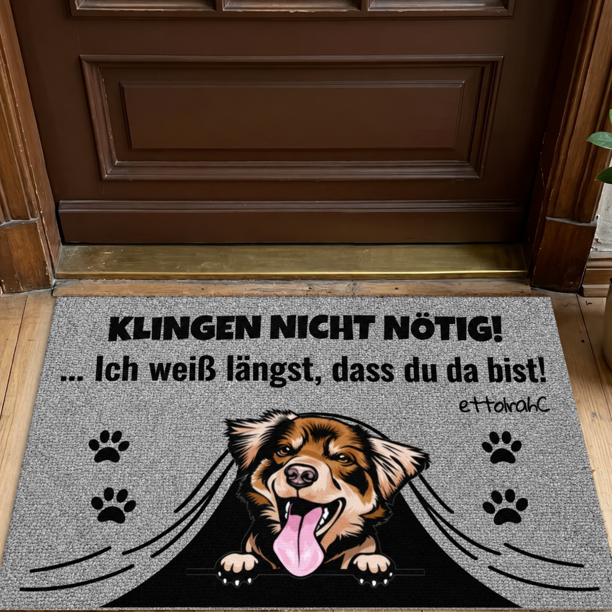 Zerbino personalizzato con motivo di cane e sfondo grigio, scritta: "KLINGEN NICHT NÖTIG!"