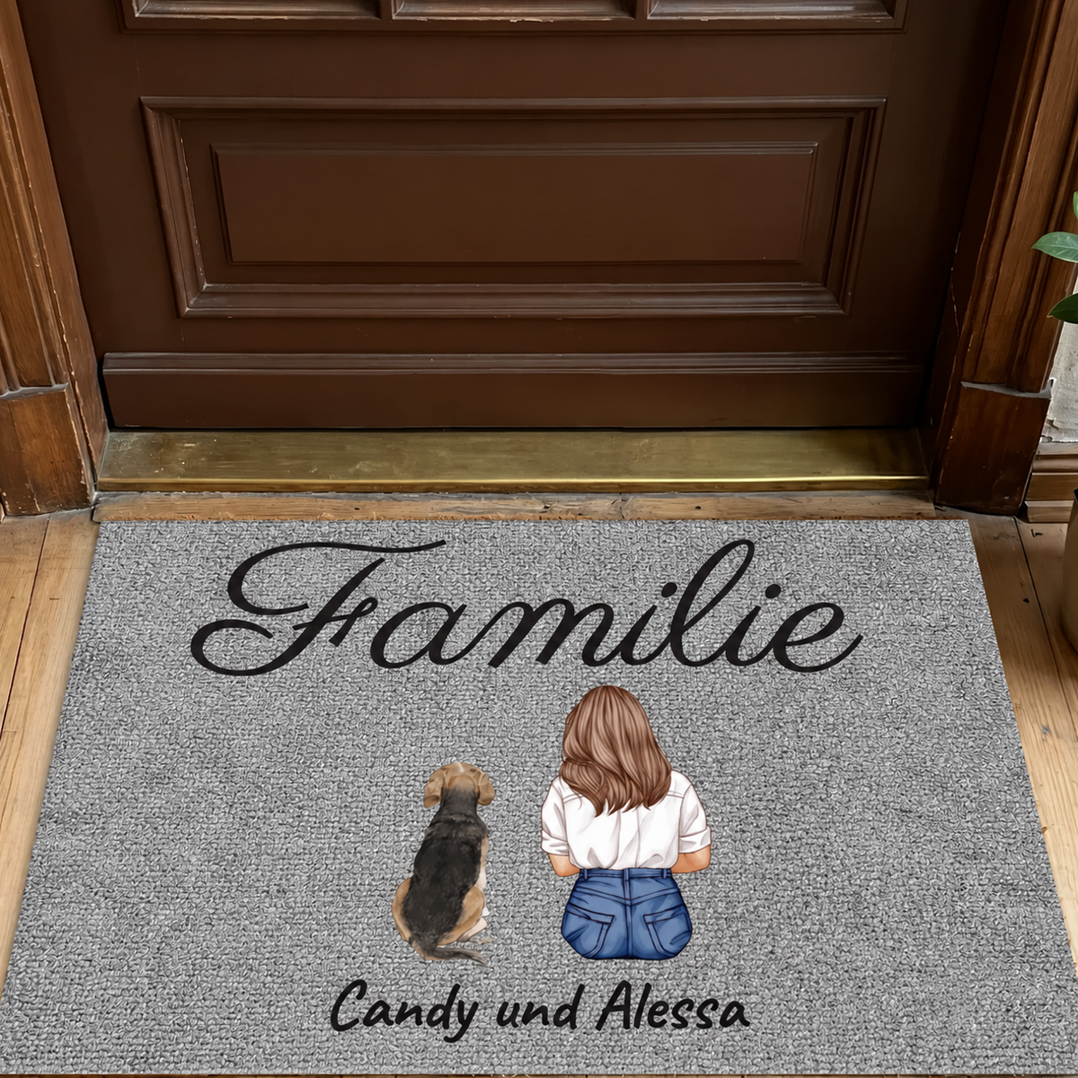 Zerbino grigio personalizzato con la scritta "Familie" e illustrazioni di una ragazza con un cane.